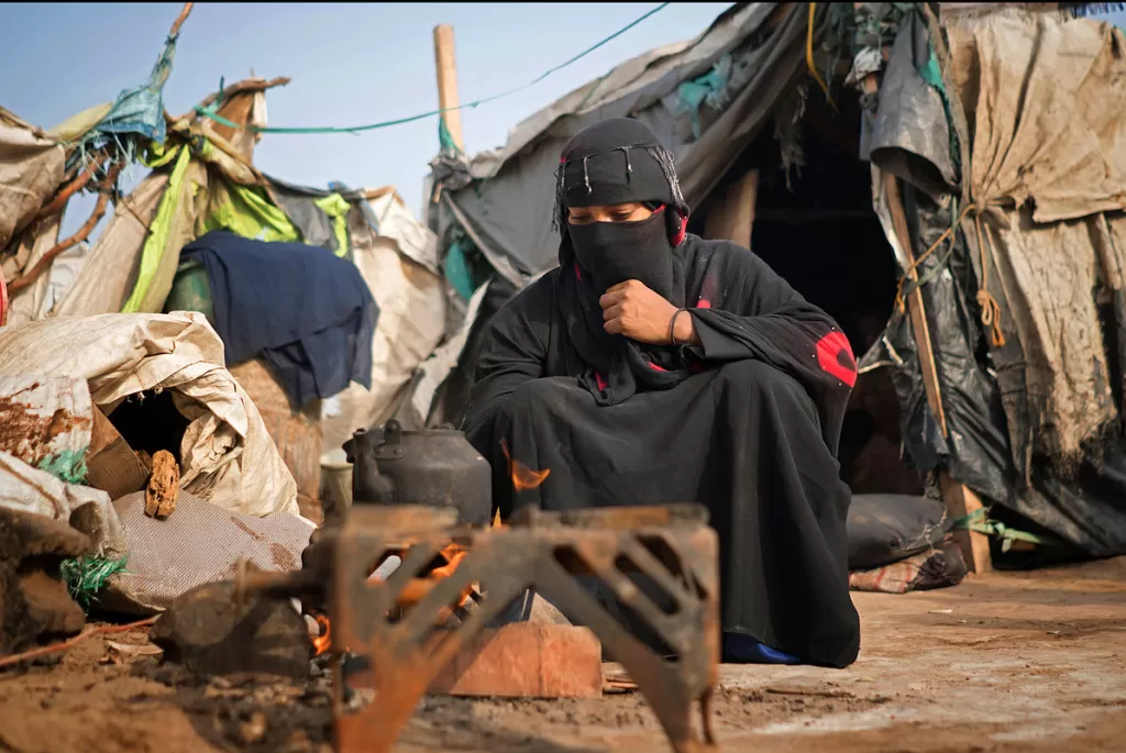 Taghreed, a mother of four, in a camp where they lack basic facilities.